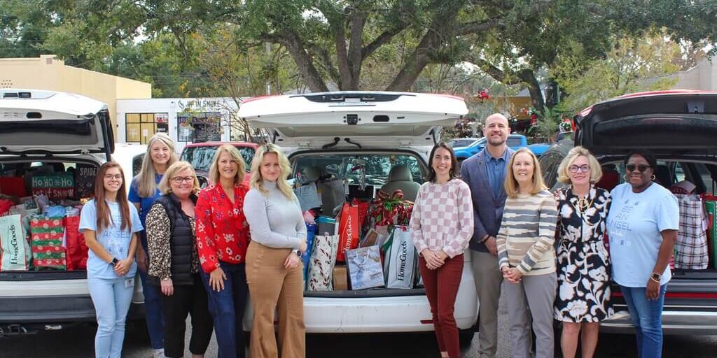 Berkshire Hathaway HomeServices Florida Network Realty’s Metro Offices purchased holiday gifts for Family Support Services’ Be an Angel campaign. From left, Kayla Garza, Leigh Ann Luttrell, Heather Cosgrove, Kimberly Waterhouse, Sandy Hume, Cat Keiter, Josh Cohen, Norma Albano, Allison Steilberg, and Rochelle Locket.